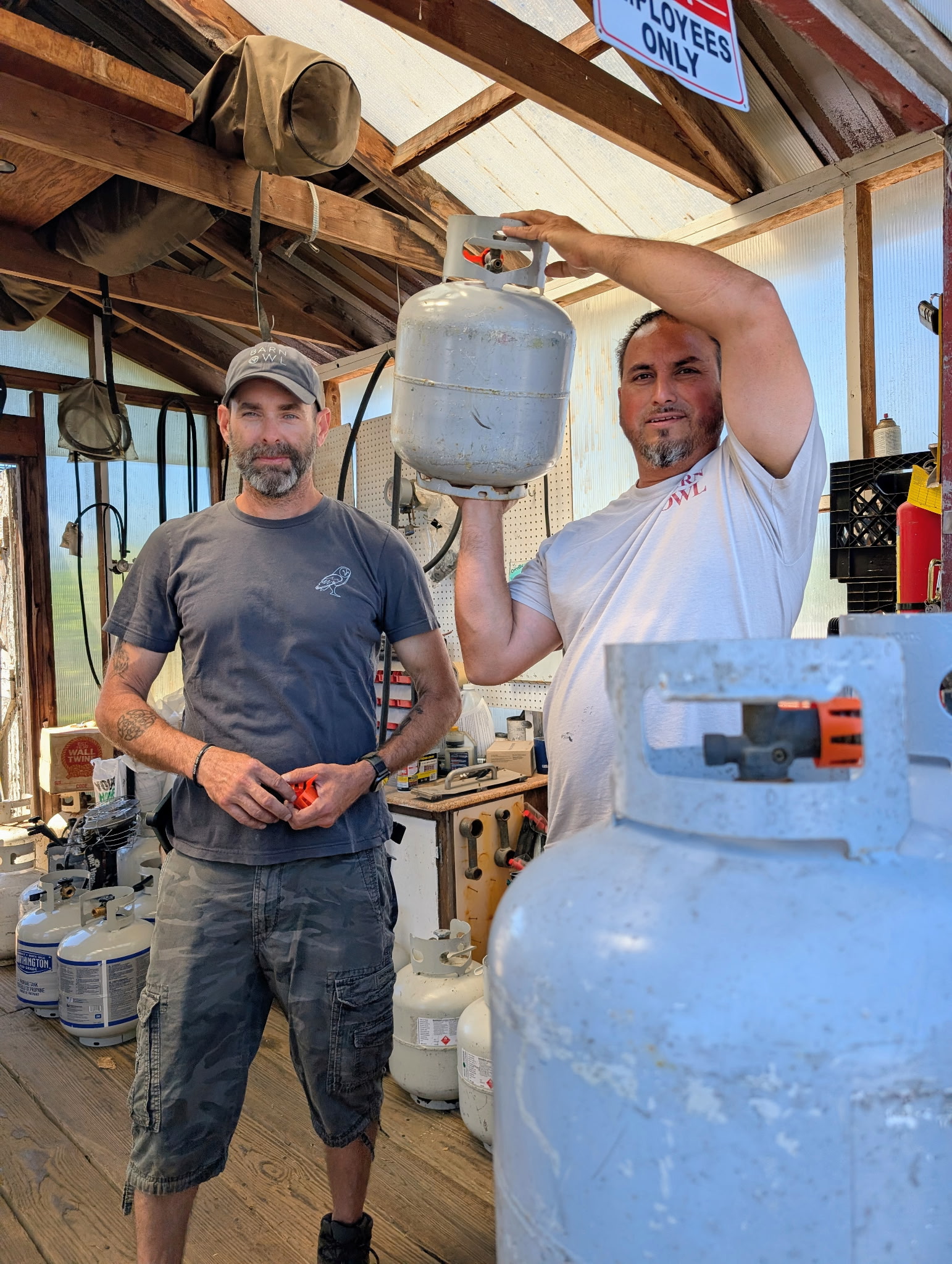 Gabe and Tristan with propane tanks at Barn Owl Garden Center